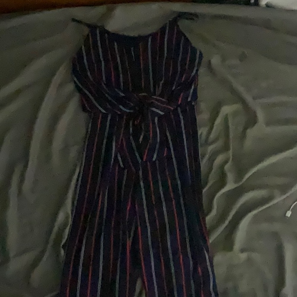 Blue jumpsuit with red and white stripes